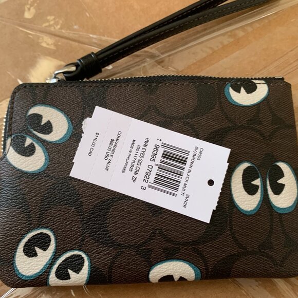 Coach Handbags - Coach small wristlet wallet Eyes NWT PRICE FIRM